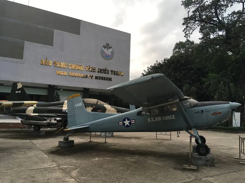 The War Remnants Museum building, with a captured US aircraft in the yard